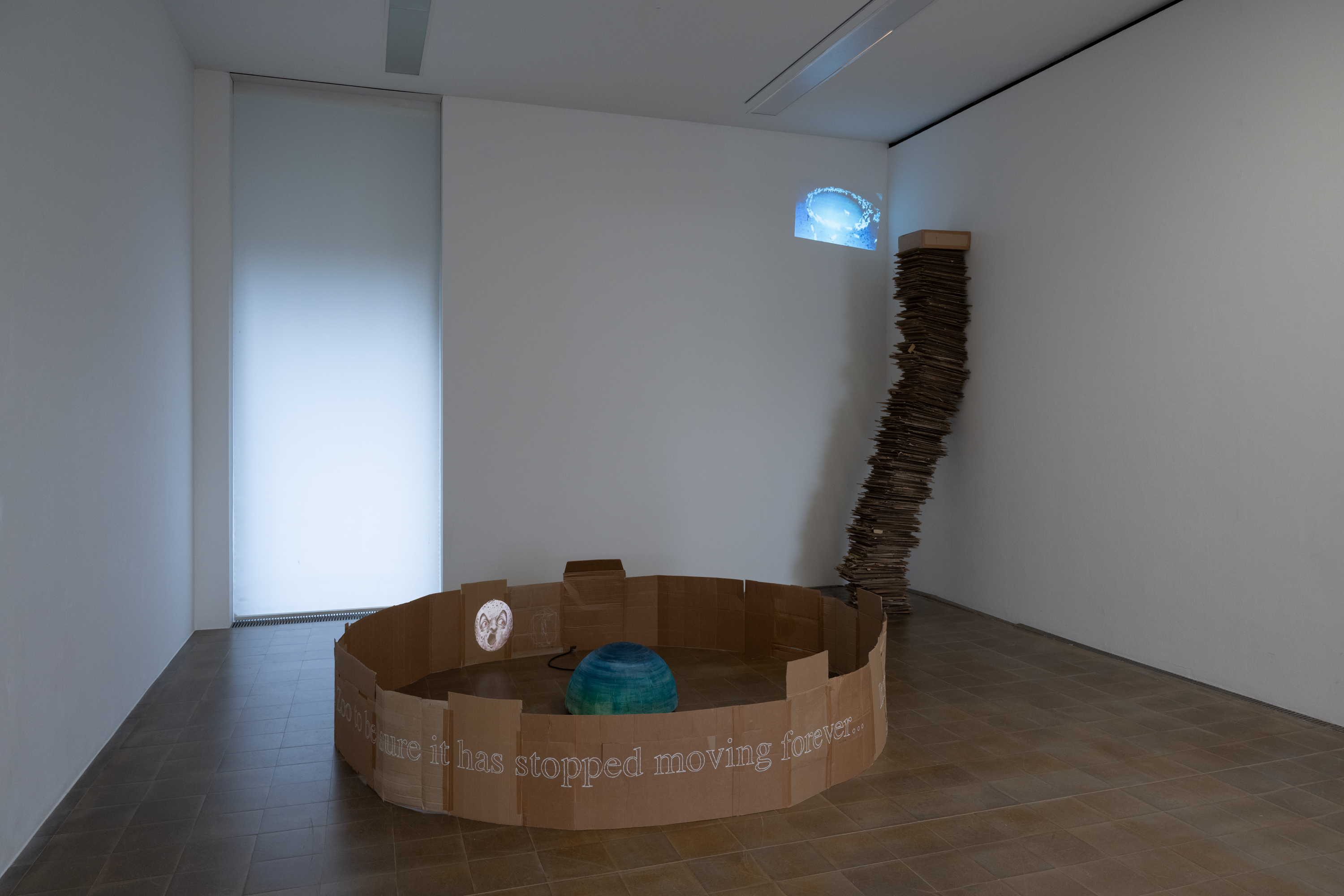 Nearest Pond, *Still Standing(?)*, 2026. Cardboard, plaster, wood, motor, tape, pastels, HD video, loop, 1'30", 53 × 300 × 300 cm; *Where did all the blue skies go?*, 2026. Cardboard, steel, HD video, loop, 2'33", 320 × 50 × 80 cm. Photo: Finn Curry.